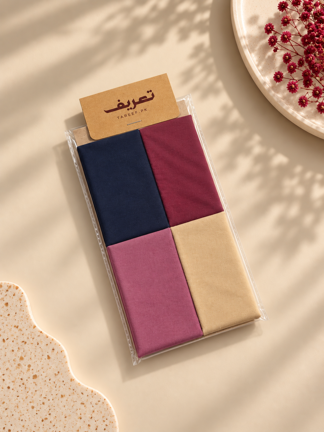 A color-blocked hijab tube displayed on a white mannequin head. The hijab tube features four color panels: dusty pink, navy blue, beige, and deep burgundy.